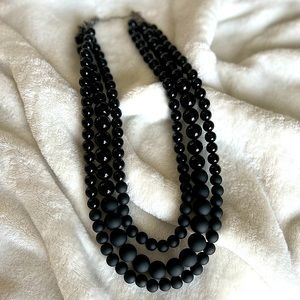 Black multi-strand bead necklace